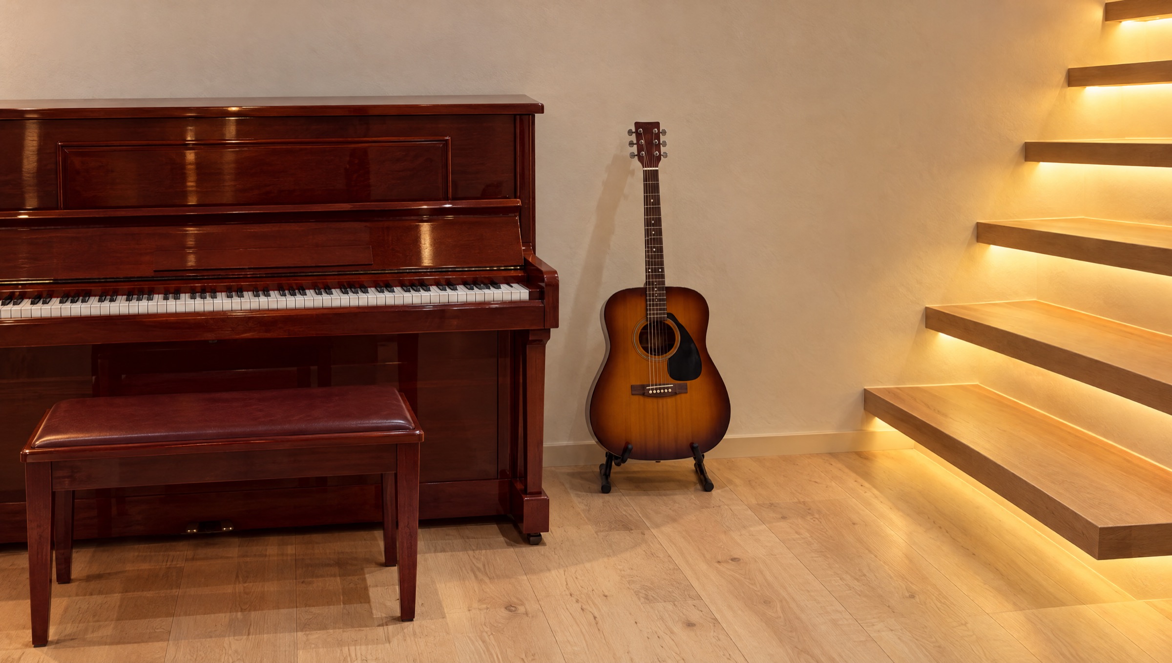 Piano and guitar beside softly lit stairs